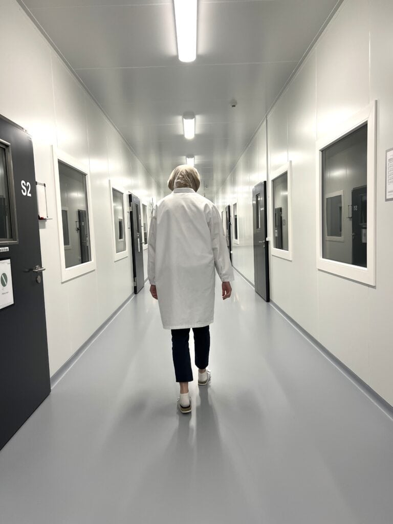 Packaging member walking down a corridor